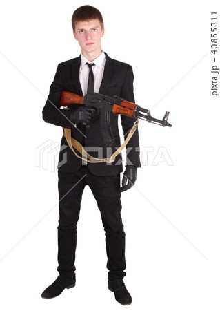 man in black suit and ak 47 40855311