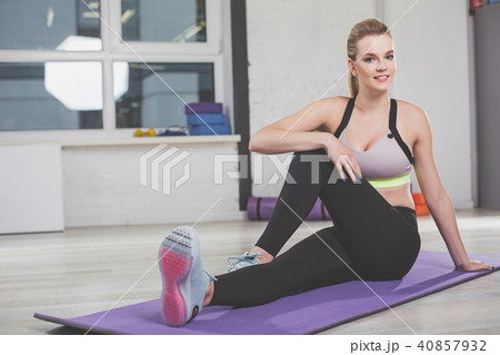Athlete girl doing physical exercises in fitness room 40857932