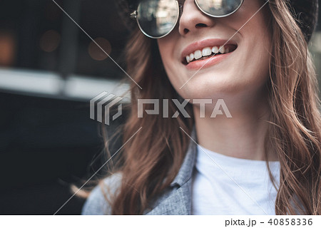 Cheerful young lady in trendy shades Cheerful young lady in trendy shades 40858336