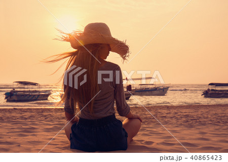 Young woman on the beach Young woman on the beach 40865423