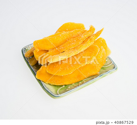 Dried Mango or Dried Mango slices on a background. Dried Mango or Dried Mango slices on a background. 40867529