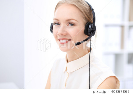 Bright  call center office. Two blonde women in a headset 40867865