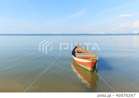 old wood fishing boat at anchor in sea 40870267