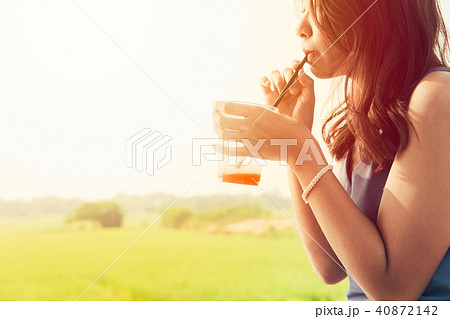 Asian Girl drink cool ice fruit soda in hot summer 40872142