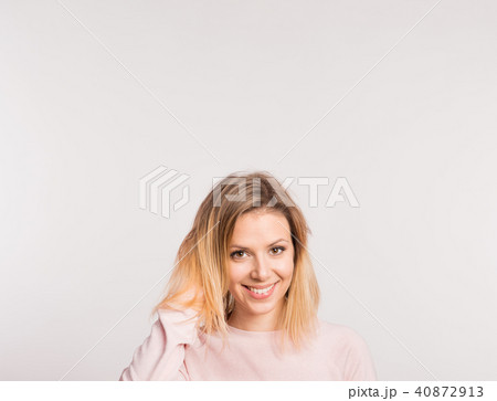Portrait of a young beautiful woman in studio on a white background. 40872913