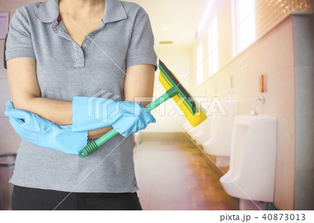 Female cleaning staff in bathroom Female cleaning staff in bathroom 40873013