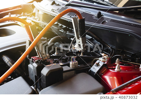 Charging battery car on blurry background. 40873032
