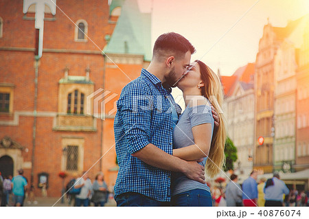 Young couple kissing on the street Young couple kissing on the street 40876074