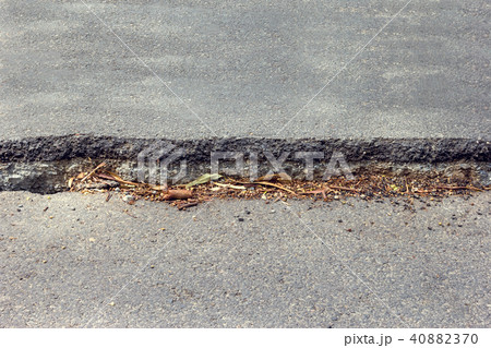 Road collapsed and subsidence cracking. 40882370