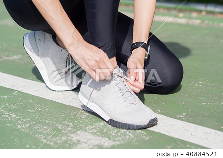 Young woman prepare for outdoor exercise in park. Young woman prepare for outdoor exercise in park. 40884521