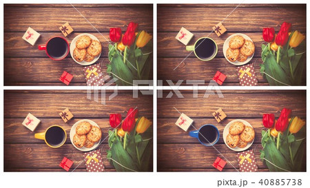 tulips bouquet and cup of coffee with cookies tulips bouquet and cup of coffee with cookies 40885738