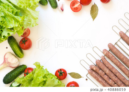 Healthy fresh vegetable for salad and raw sausages Healthy fresh vegetable for salad and raw sausages 40886059