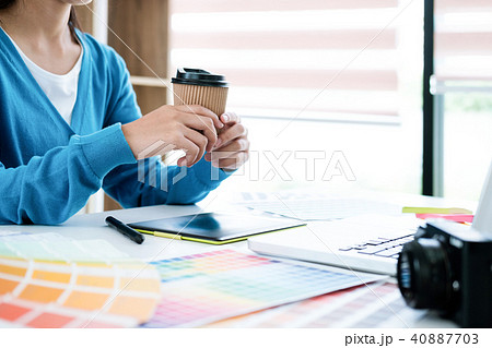 Graphic designer and photo editor working. 40887703