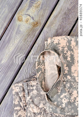 Set of camoulfage military clothes on wood. Set of camoulfage military clothes on wood. 40889374