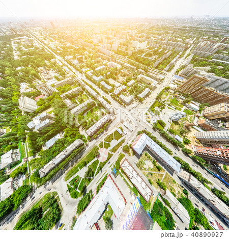 Aerial city view with crossroads and roads, houses, buildings, parks and parking lots. Sunny summer 40890927