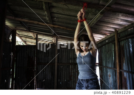 Hostage or female kidnapping tied by rope 40891229