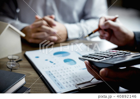 Real estate broker agent being analysis and making the decision Real estate broker agent being analysis and making the decision 40892146