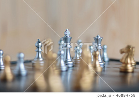 Silver and gold chess set on board Silver and gold chess set on board 40894759