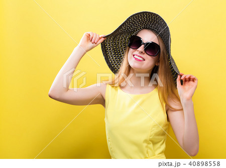 Happy young woman wearing a hat Happy young woman wearing a hat 40898558