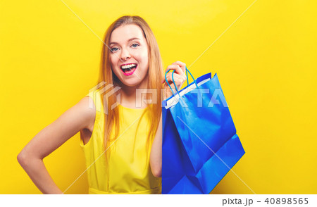 Young woman holding a shopping bag Young woman holding a shopping bag 40898565