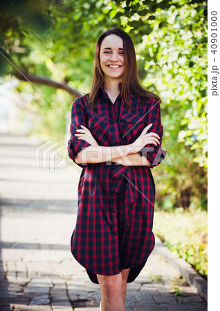 cute girl in a checkered dress at summer park 40901000
