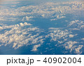 sunrise above clouds from airplane window 40902004