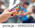Hand holding an Octopus Smart card in MTR train  40902034