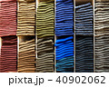 Wooden shelves with stack of different color socks 40902062