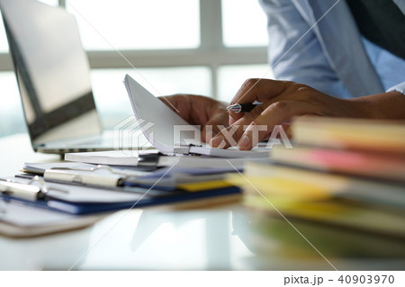 Businessman working reading documents graph 40903970