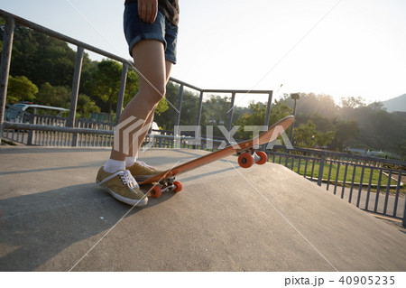 skateboarder skateboarding on skatepark ramp 40905235