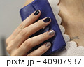 Beautiful female hand with manicure  40907937