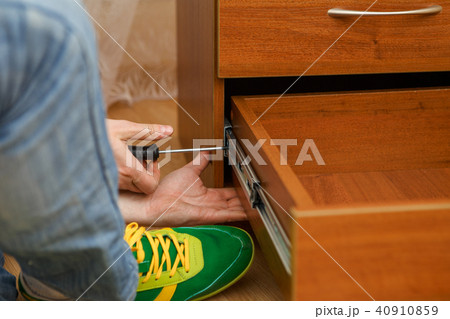 Photo of man picking furniture 40910859