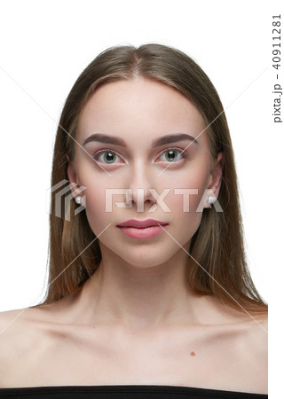 Portrait of a girl with light day make up looking at camera. 40911281