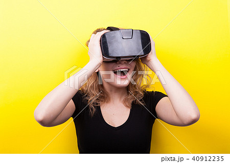 Beautiful woman enjoying virtual reality experience 40912235