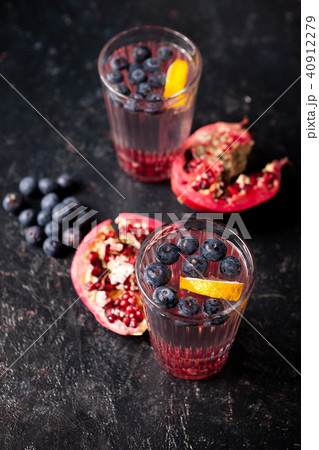 Two glasses with infused water with organic berries and pomegranate 40912279