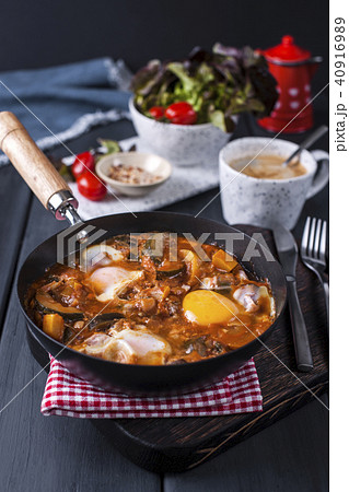 Shakshuka, Fried Eggs in Tomato Sauce for Easter Brunch. Top view. Shakshuka, Fried Eggs in Tomato Sauce for Easter Brunch. Top view. 40916989