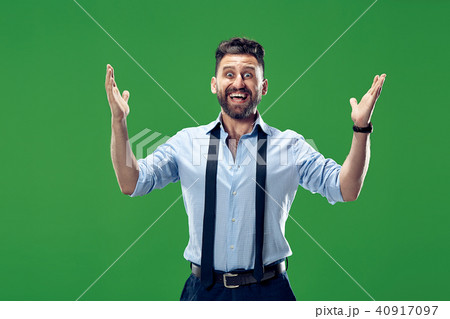 Winning success man happy ecstatic celebrating being a winner. Dynamic energetic image of male model 40917097