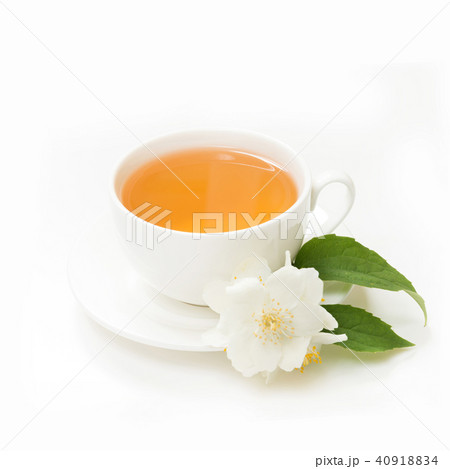 Jasmine flowers and cup of green tea on white.  40918834