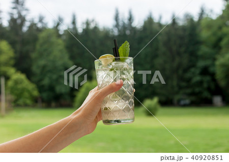 glass of mojito in female hand glass of mojito in female hand 40920851