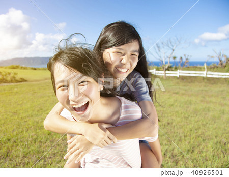 teenager girls playing piggyback and having fun 40926501