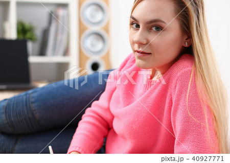 young beautiful blond woman lie on the floor read book young beautiful blond woman lie on the floor read book 40927771