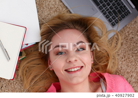 young beautiful woman lie on floor have a lot of work is tired young beautiful woman lie on floor have a lot of work is tired 40927902
