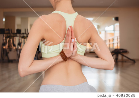 Young woman practicing yoga  40930039