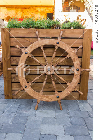 Steering the boat. Steering wheel captain. 40933248