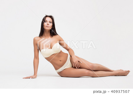 Girl in lingerie on white background 40937507