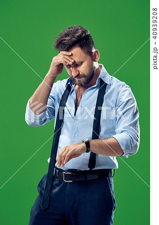 Handsome businessman checking his wrist-watch Isolated on white background Handsome businessman checking his wrist-watch Isolated on white background 40939208