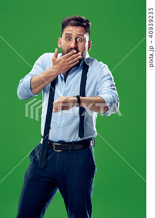 Handsome businessman checking his wrist-watch Isolated on white background Handsome businessman checking his wrist-watch Isolated on white background 40939235