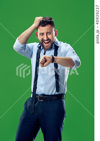 Handsome businessman checking his wrist-watch Isolated on white background Handsome businessman checking his wrist-watch Isolated on white background 40939237