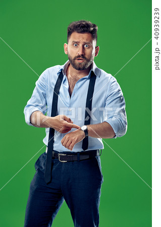 Handsome businessman checking his wrist-watch Isolated on white background 40939239