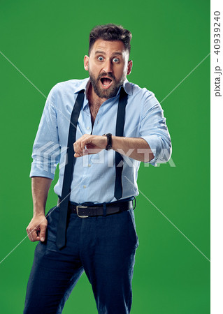 Handsome businessman checking his wrist-watch Isolated on white background 40939240